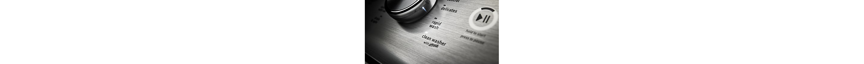 A washing machine dial set to the clean washer setting.
