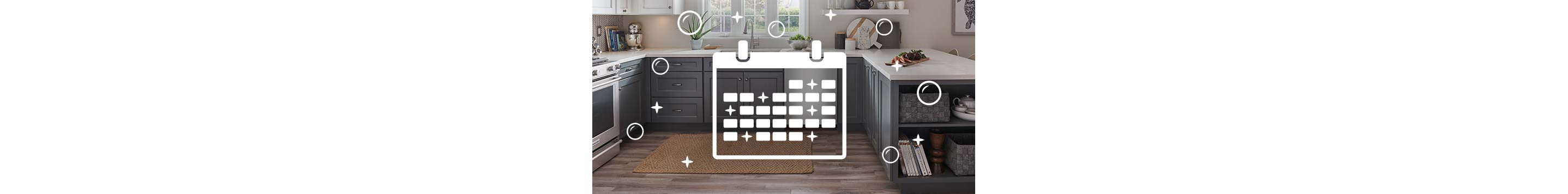 Calendar overlays a clean kitchen with a dishwasher and stove.