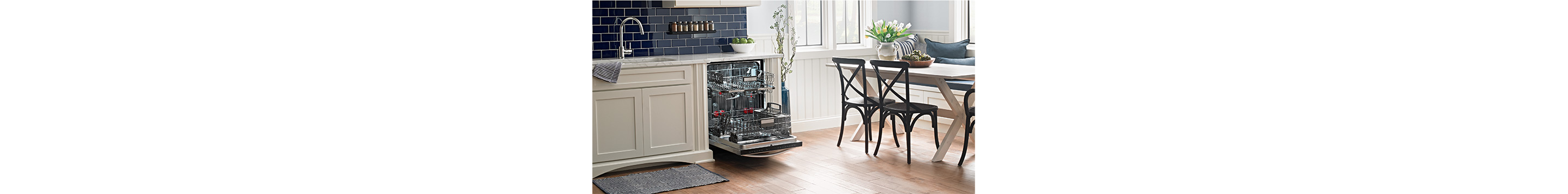 A clean empty dishwasher in a kitchen.